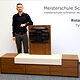 Portrait von Roland Rein mit seinem Schreinermeisterstück "TV-Lowboard"